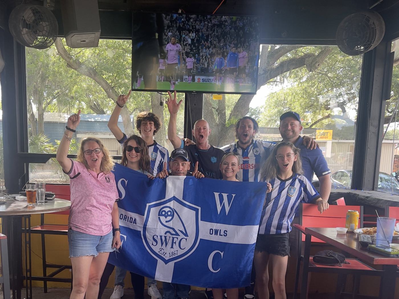 Tampa Owls celebrating in the bar