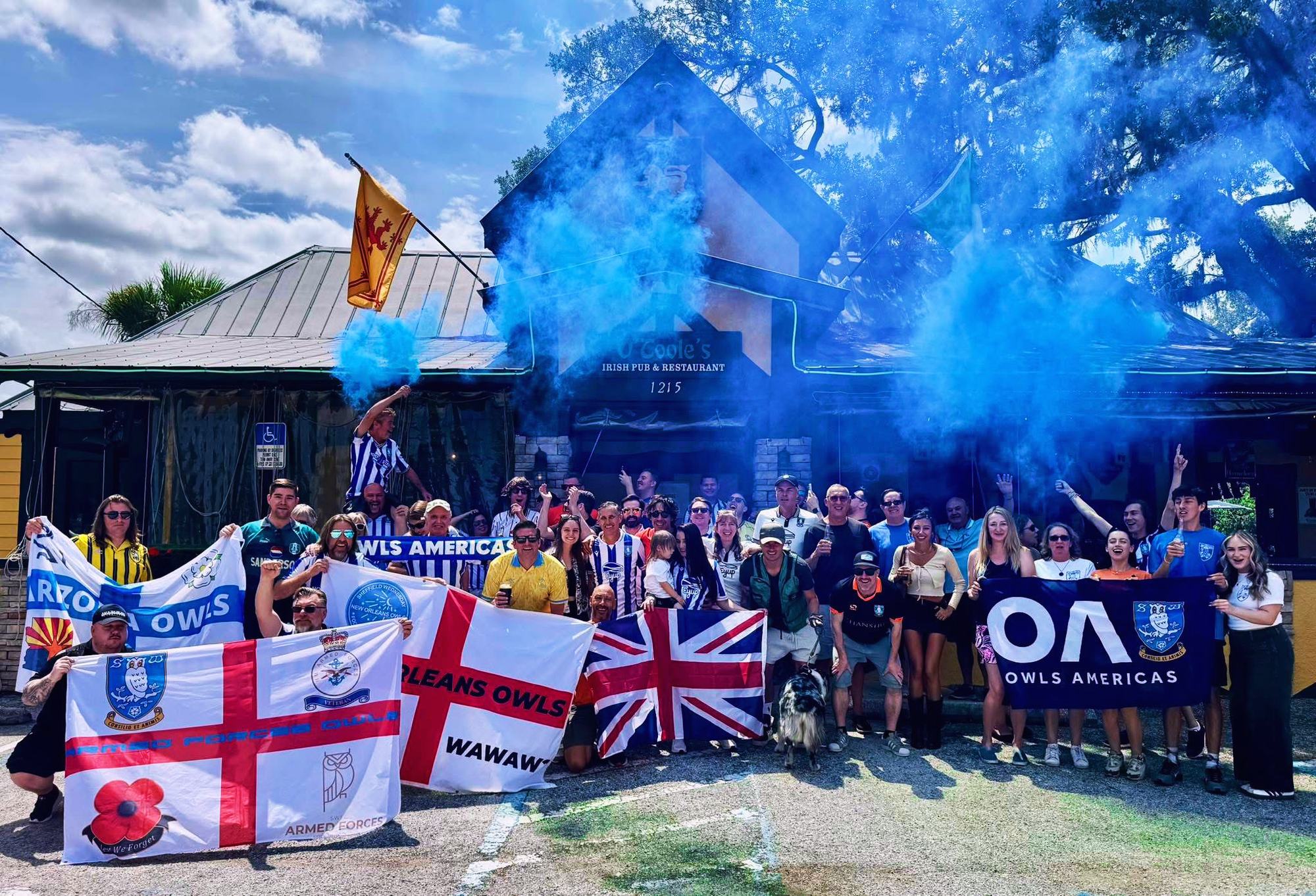 Tampa Owls with flags and blue smoke